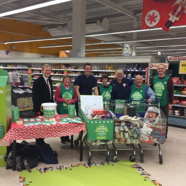 Sir David helped with the neighbourhood Food Collection